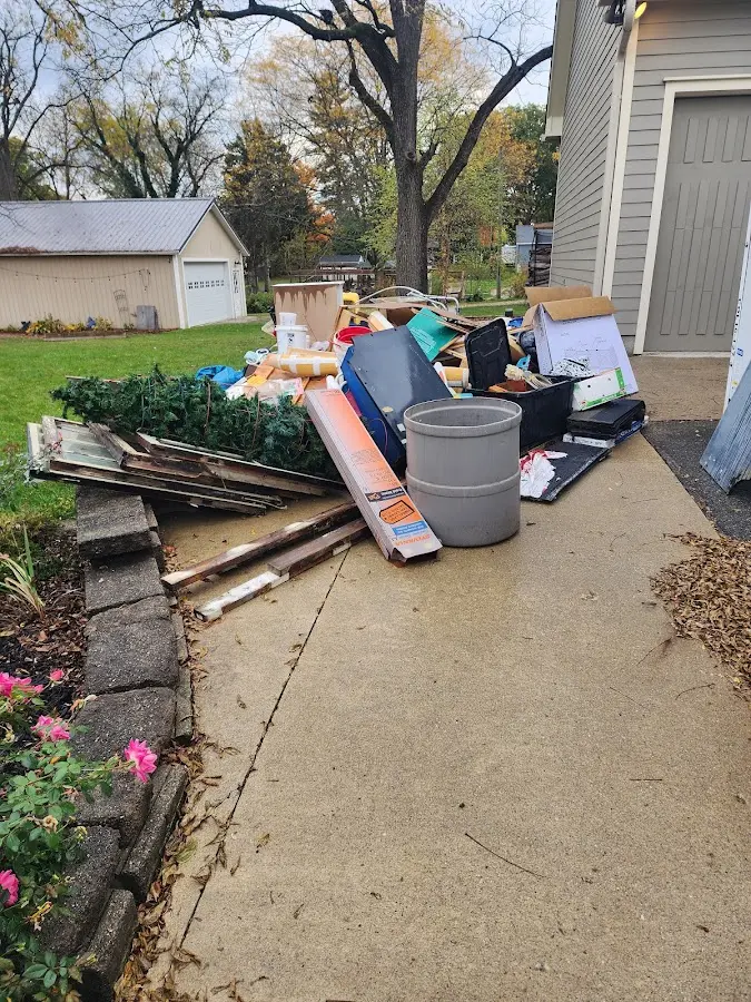 Dumpster being loaded with debris for 3 Yard Dumpster Rental in Boonville